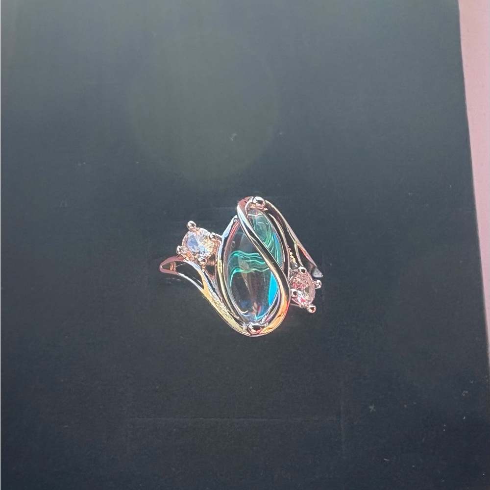 Mystic Moonstone Twist Ring – Sterling Silver Elegance